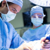 Hani Sbitany, MD, a plastic and reconstructive surgeon at UCSF Health, performs a breast reconstruction surgery. Sbitany is one of a few surgeons using a procedure that is less invasive and has a less painful recovery.