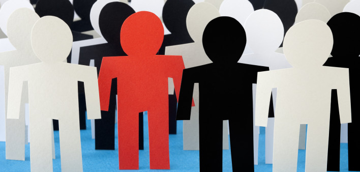 on red paper figure among others