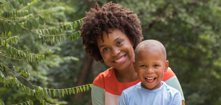 African American mother holding her son