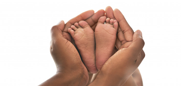 Hands and baby feet