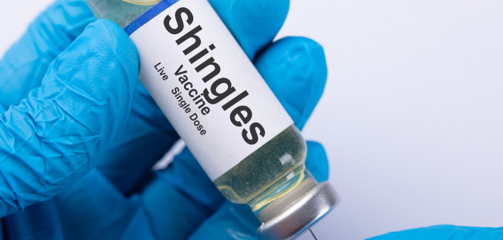 Close-up Of A Doctor's Hand Filling Shingles Vaccine Syringe