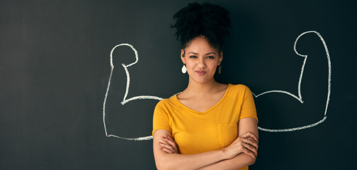 strong woman crossed arms blackboard