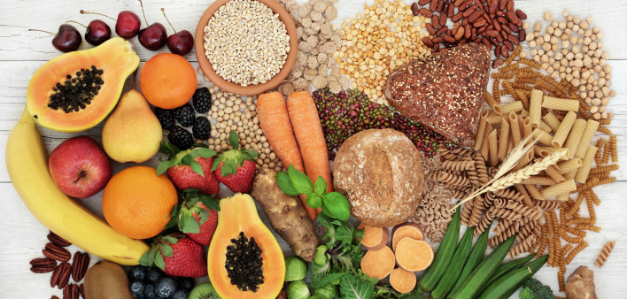 food with high fiber content for a healthy diet with fruit, vegetables, whole wheat bread, pasta, nuts, legumes, grains and cereals