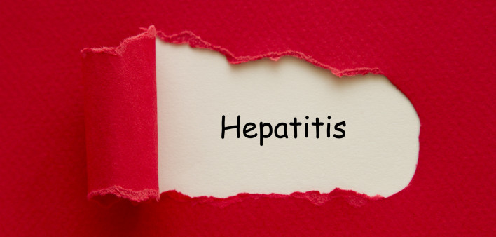 Hepatitis word written under torn paper