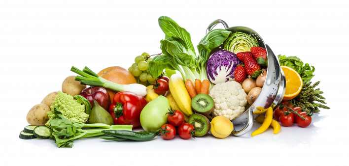 Healthy fresh fruits and vegetables in a colander