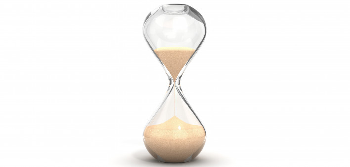 an hourglass with sand running downwards
