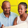 black man and woman looking at menu at restaruant table