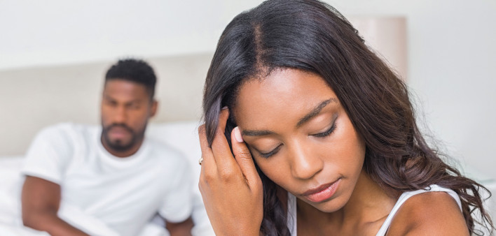couple in bedroom pensive