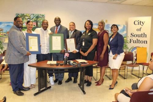 Brown and Etheredge-Brown with officials from the City of South Fulton.
