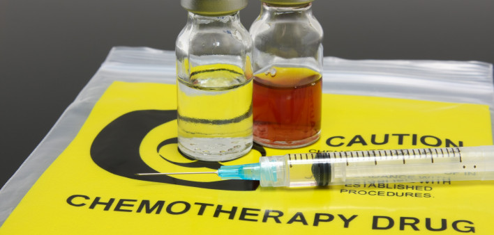 A syringe and two vials of chemotherapy drugs