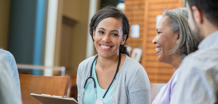 Healthcare professional talks with patients