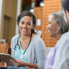Healthcare professional talks with patients