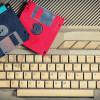 old computer keyboard and floppy disks