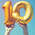 hand holding up ballons 10 ten