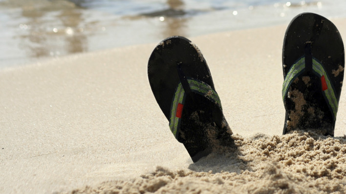 flip flops at beach and women in bikinis