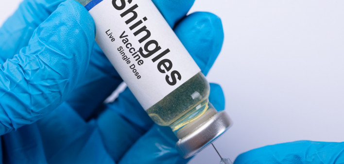 Close-up Of A Doctor's Hand Filling Shingles Vaccine Syringe