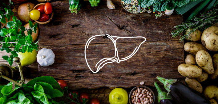 A table of food with a drawing of a liver