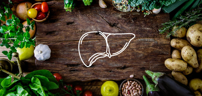 A table of food with a drawing of a liver