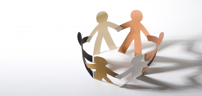 paper cut out dolls joined hands in a circle