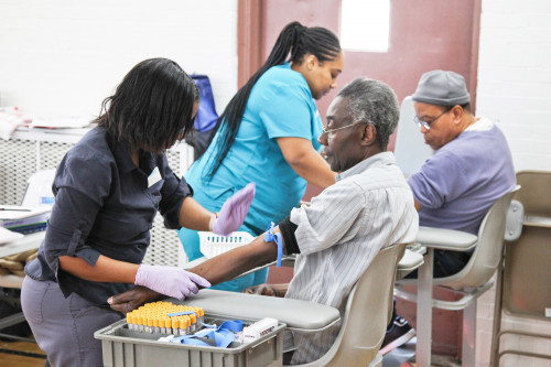 Men give blood at recent Fans for Cure event in Brooklyn, New York.