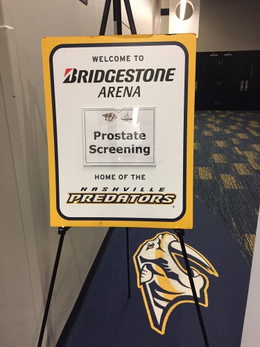 Prostate screening signage by Fans for the Cure at Nashville Predators hockey game.