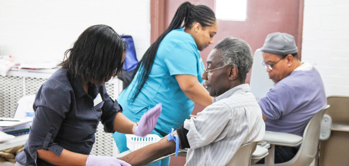 Men give blood at recent Fans for Cure event in Brooklyn, New York.