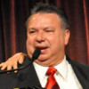Humberto Cruz receives an award from the Latino Commission on AIDS in 2011, presented by actress Rosie Perez