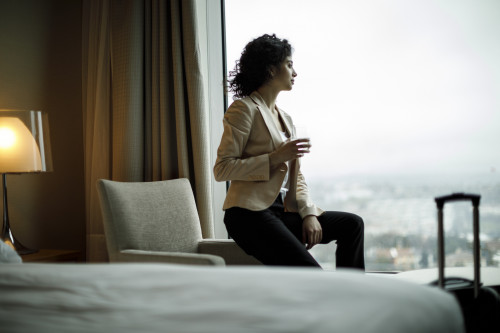 Businesswoman relaxing in a hotel room