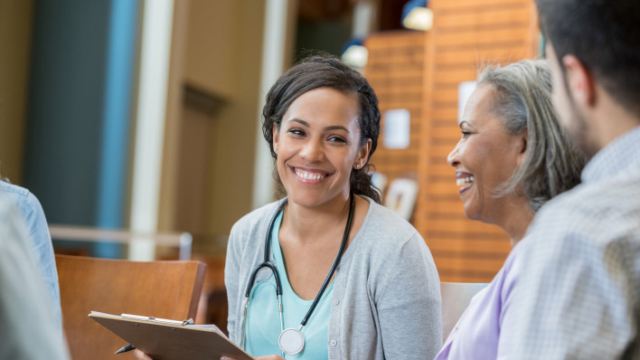 Healthcare professional talks with patients