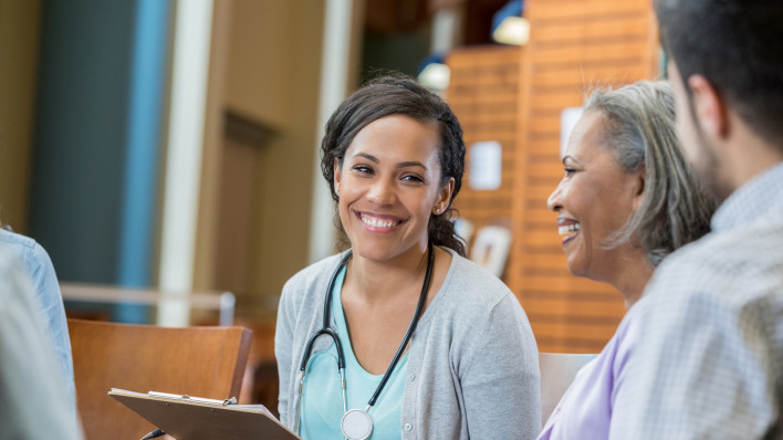 Healthcare professional talks with patients