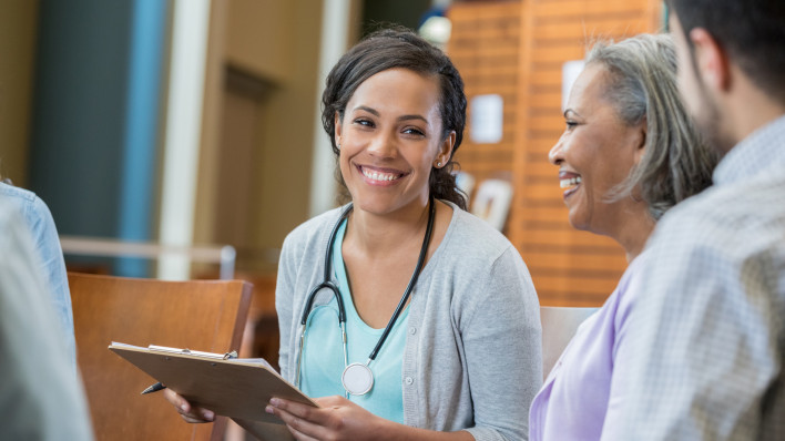 Healthcare professional talks with patients