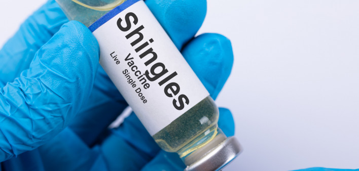 Close-up Of A Doctor's Hand Filling Shingles Vaccine Syringe