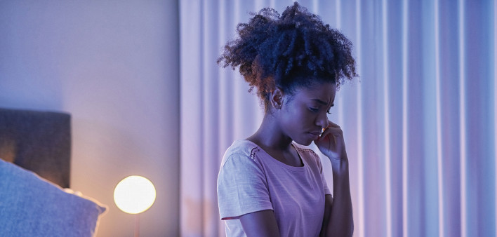 depressed black girl in bedroom