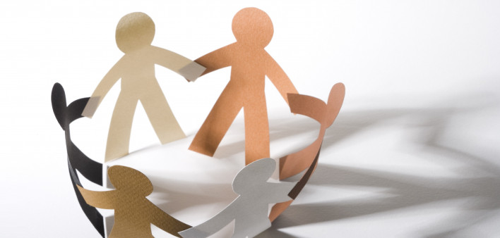 paper cut out dolls joined hands in a circle