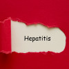 Hepatitis word written under torn paper