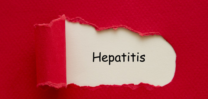 Hepatitis word written under torn paper