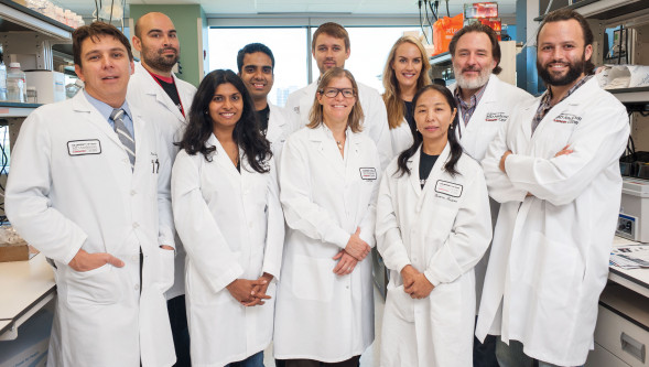 Jennifer Wargo, MD (center), and her team at MD Anderson Cancer Center, including Christine Spencer, PhD (back row, third from right).