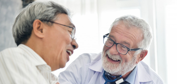 Happiness of Senior male Doctor with Asian male patient