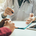 Doctor talking to the patient about menopause and treatment in future.