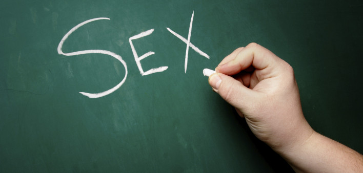 "SEX" being written on a blackboard