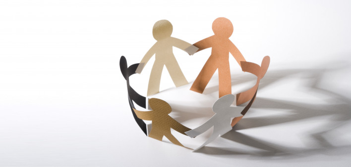 paper cut out dolls joined hands in a circle