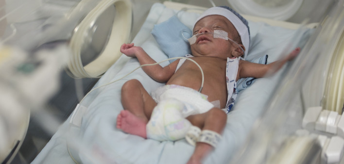 Beautiful newborn baby boy in the neonatal intensive care unit sleeping