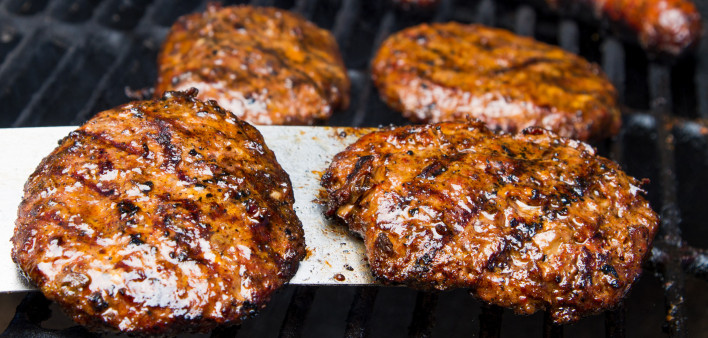 hamburgers and hotdogs on the grill