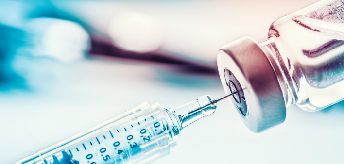 needle inserted into vial