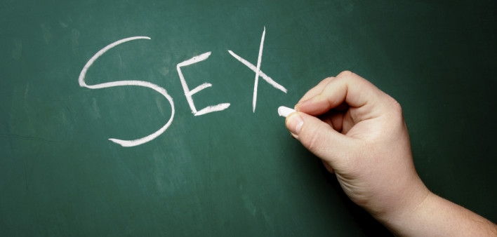 "SEX" being written on a blackboard