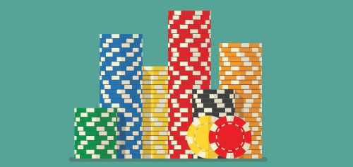 stack of poker chips on green backround