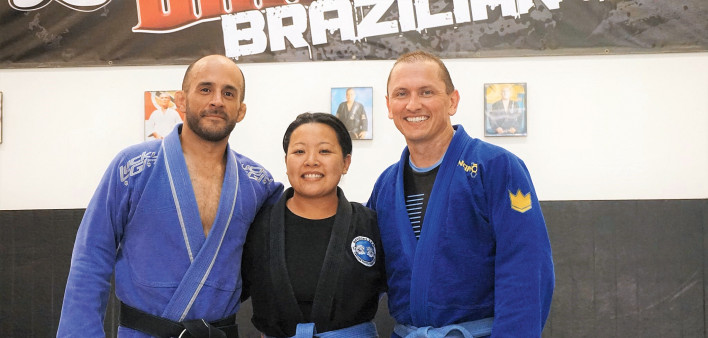 Avie Barron with her husband, Tim (right) and her coach, Orlando