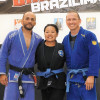 Avie Barron with her husband, Tim (right) and her coach, Orlando