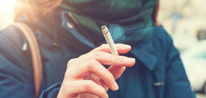 Young woman enjoying a cigarette