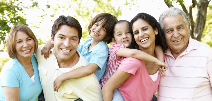 A multi-generational latin family having fun outdoors